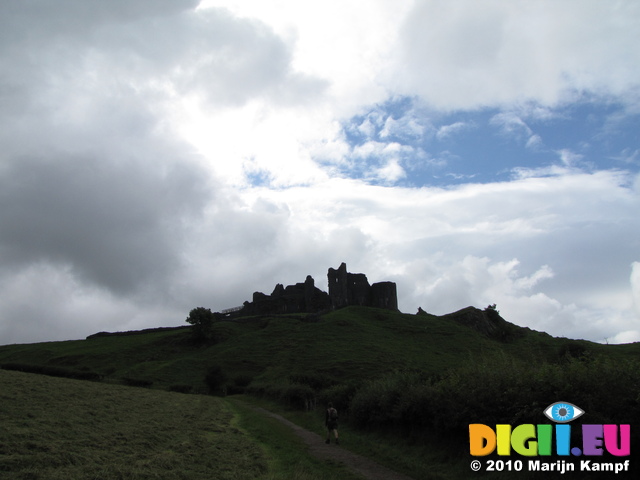 SX16085 Silhouette of Carreg Cennen Castle on top of hill